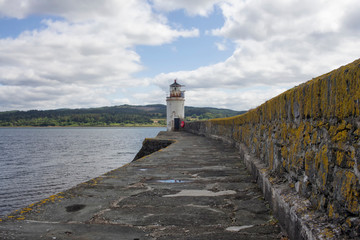 A light house in Argyle Scotland on a summers day.