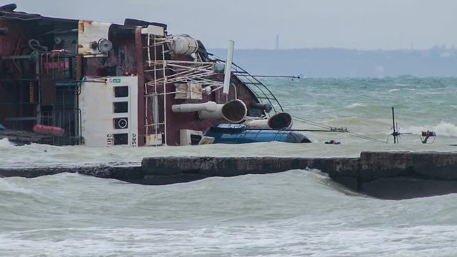 Odessa, Ukraine 11.22.2019: The wreck of the tanker "Delfi" on the Odessa beach. Ecological disaster - oil spill on city beaches as a result of a shipwreck.