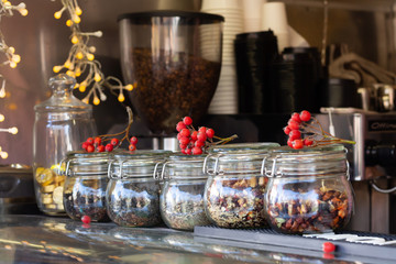 Tea jars are on the table in the coffee shop