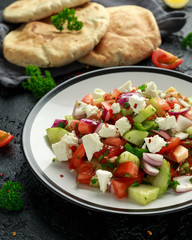 Turkish Shepards Salad with cucumber, tomato, red onion, pepper, parsley pita bread and Feta cheese