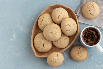 Cup of coffee on the table with homemade cookies. Flat lay