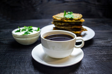 morning breakfast coffee with potato pancakes with sour cream