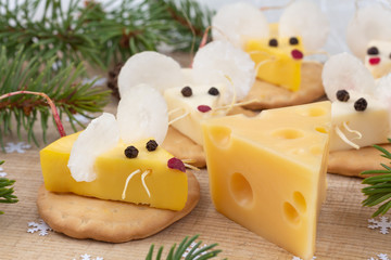 Festive food for the New Year 2020. Year of the white rat. Mouse shaped cheese appetizer. Christmas mood.