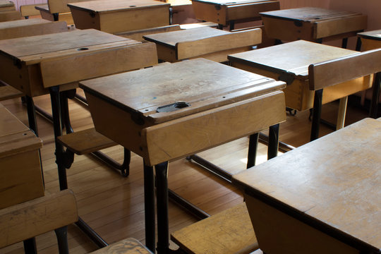 Old fashioned classroom and school desks 