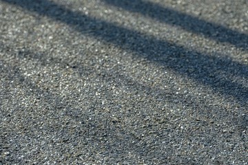steiniger grauer Hintergrund mit Schatten