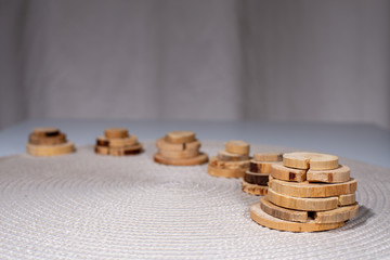 decorative wooden circles on a white blanket