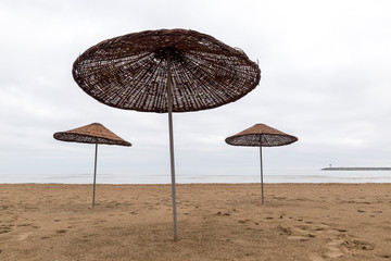 Umbrellas on empty beach 