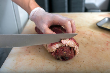 cutting beef in the butcher shop