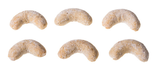 Vanilla crescent roll sweets. Set of fragrant baked pastries isolated on white background. Close-up of traditional Czech Christmas and wedding nutty cookies in shape of rolls dusted with icing sugar. © KPixMining