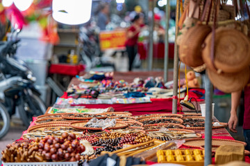 Handmade gifts up for sale for tourists in the market stalls found in the capital city of Hanoi, Vietnam