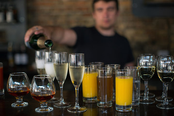 bartender pours drinks