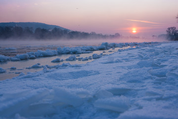 cold sunrise in Dresden with ice floes on the river