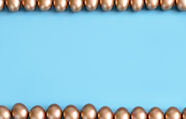 Background with Easter eggs in gold color.