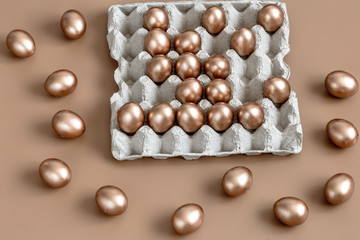 Background with Easter eggs in gold color.