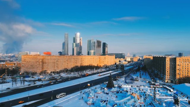 Festive New Year Moscow with a view of the ice city with slides, Christmas tree and Skyscrapers Moscow City. Copter ( drone ) shooting