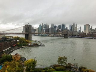 Fototapeta na wymiar Brooklyn Bridge as seen from Manhattan Bridge on a wet cloudy day