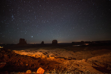 A starry night over the Mitten Buttes in Monument Valley