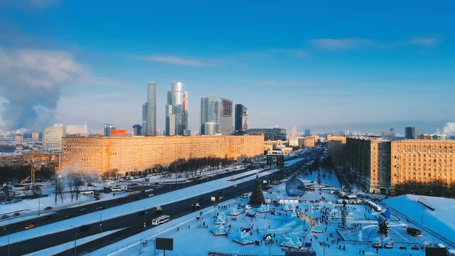 Festive New Year Moscow with a view of the ice city with slides, Christmas tree and Skyscrapers Moscow City. Copter ( drone ) shooting