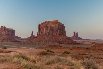 The very last sunset sunbeams lighting the top of the mesas in Navajo Land, AZ