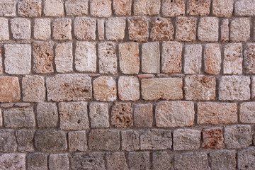 Old limestone sandstone wall. Abstract background wall texture. Old vintage wall. Wall texture for architecture.
