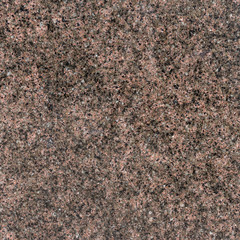 Red granite texture background. Red base with black and gray Spots. Natural background texture.