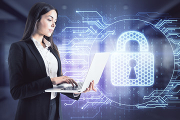 Businesswoman holding laptop