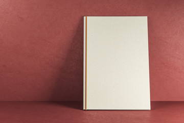 Empty white text book on red background
