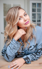 portrait of a young blonde woman with blue eyes 