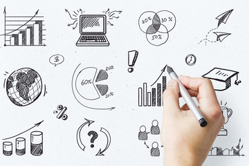 Businessman hand drawing charts