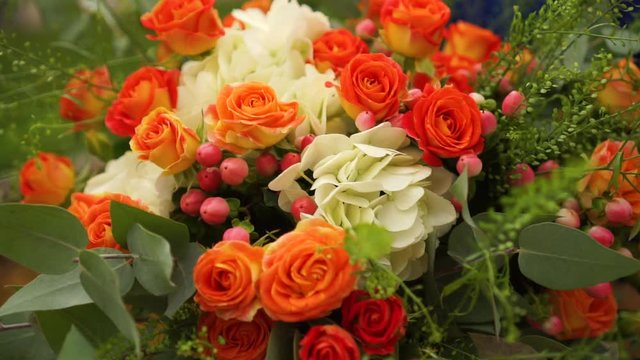 Wedding bouquet of roses, hydrangeas, Hypericum and eucalyptus branches