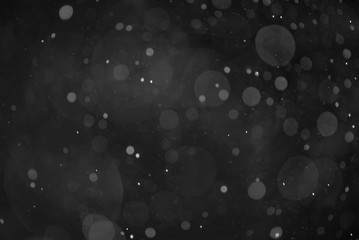 Snow or rain bokeh texture on black background