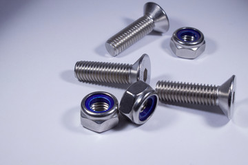 Countersunk bolts from stainless steel on a white background.