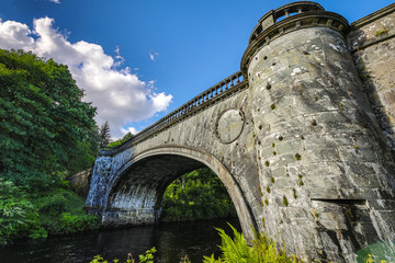 Old bridge and picturesque Scotland morning landscape.