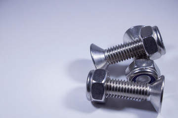 Countersunk bolts from stainless steel on a white background.