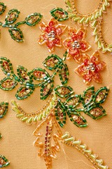 Fabric with sequins and sequins of bright colors. Fashion glitter fabric, sequins. Shiny surface