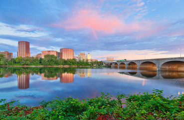 Fototapeta na wymiar Beautiful sunrise over Connecticut River at Hartford Connecticut. Photo shows the skyline of Hartford and Bulkeley Bridge, which is the oldest highway bridges over the Connecticut River in Hartford.