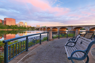 Beautiful sunrise over Connecticut River at Hartford Connecticut. Photo shows the skyline of Hartford and Bulkeley Bridge, which  is the oldest  highway bridges over the Connecticut River in Hartford.