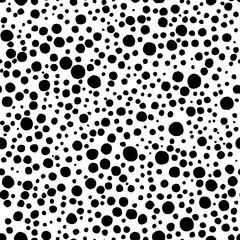 Black and white seamless polka dot pattern. Random ink circles and splashes. Cute simple doodle style pattern. Background for textile. Vector illustration.