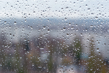 Raindrops on window glass surface, background texture