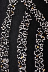 Fabric with sequins and sequins of bright colors. Fashion glitter fabric, sequins. Shiny surface