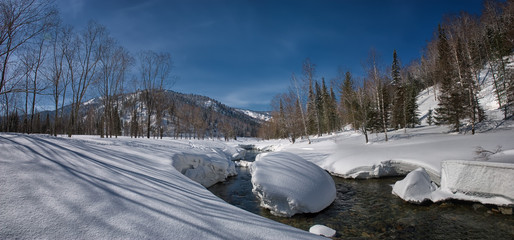 mountain resort, winter landscape in the mountains on a sunny day, blue sky and white fluffy snow...