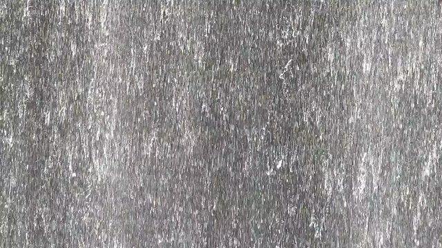 Background of sheets of water falling down a wall