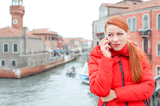unhappy young woman reading bad news on smart phone