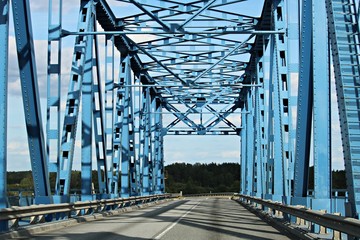 Old metal arch bridge over the Lielupe river. Latvia, September 2019