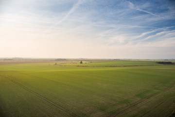 Obraz premium Panorama of beautiful fields in South Bohemian Moravian Tuscany, czech republic, nice blue sky with sun in the evening.