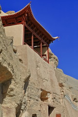 Two tiered-red painted wooden porch of cave 130-Mogao Caves. Dunhuang-Gansu-China-0620