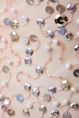 Fabric with sequins and sequins of bright colors. Fashion glitter fabric, sequins. Shiny surface