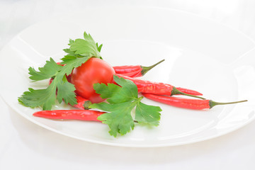 Chili peppers, tomatoes and parsley