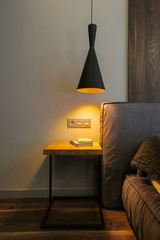 Lamp and table near the bed
