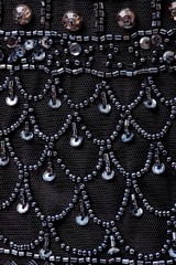 Fabric with sequins and sequins of bright colors. Fashion glitter fabric, sequins. Shiny surface